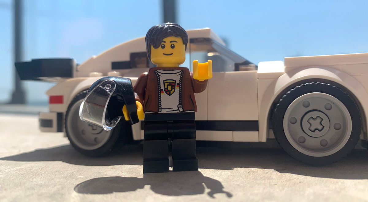 The minifig included with the '74 911 Turbo wears a cool drivers collection shirt and leather jacket. Ready for track action too with that helmet.