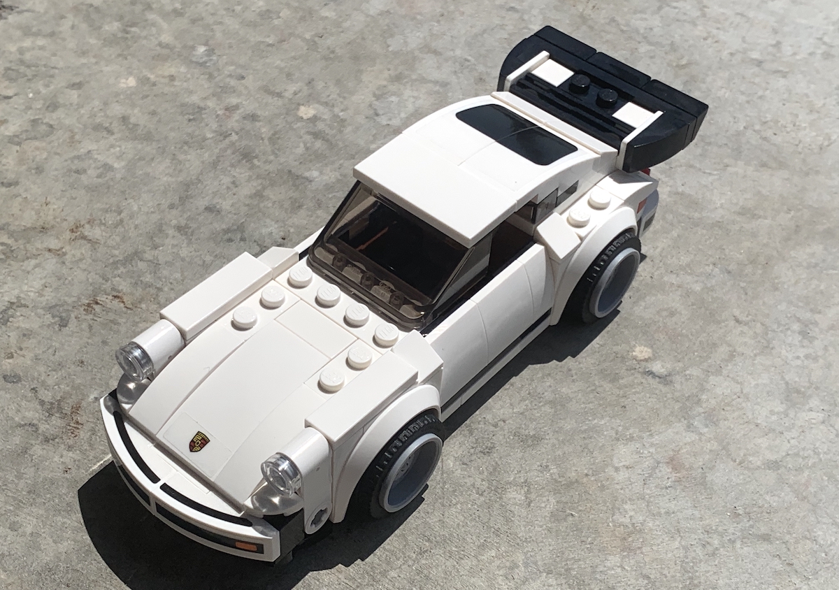 Top down view of the LEGO Speed Champions '74 Porsche 911 Turbo really shows off the exposed studs, that huge rear wing and even those clear stickers for the Porsche badge and bumper details.