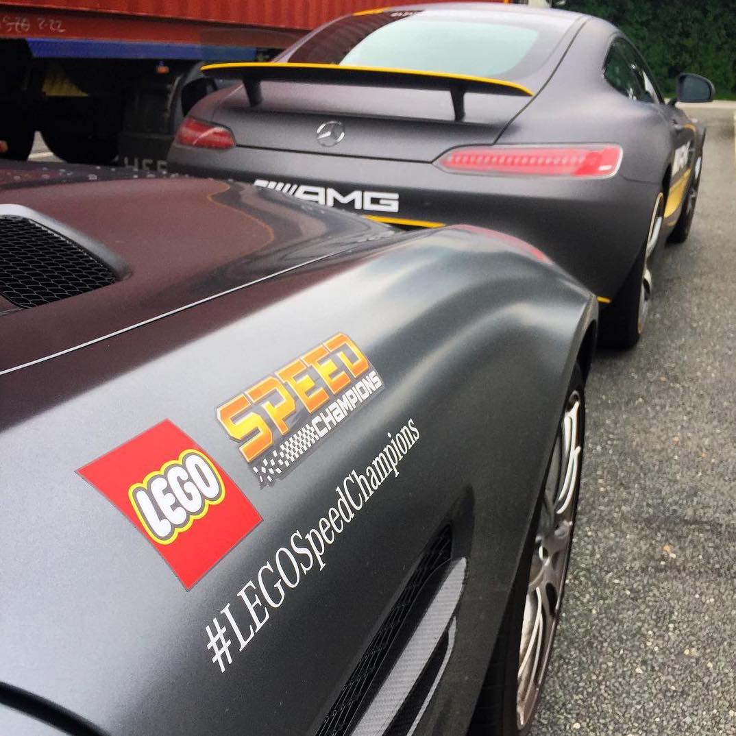 The pair of Mercedes-Benz AMG GT cars with yellow stickers and LEGO Speed Champions logos that were driven from the Nurburgring 24H Race to the LEGO Headquarters in Billund, Denmark. Image © craigc via Instagram.