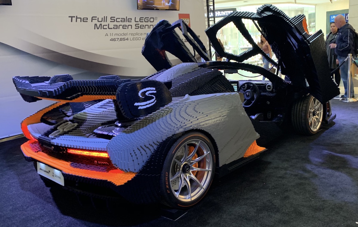 The full scale LEGO McLaren Senna on display at Bluewater Shopping Center in Kent, UK. This angle really shows off the rear lights and tailpipes, along with the genuine McLaren steering wheel, infotainment system, wheels and tyres in use on the model.