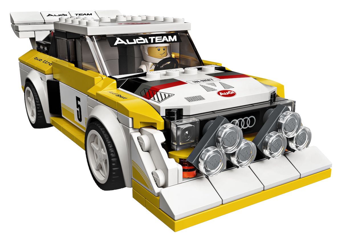 The LEGO Speed Champions 1985 Audi Sport quattro S1 in its classic yellow and white livery from rally days. Hard to miss this model being 8 wide with that wide splitter and the two fog light banks on the front of the model. The wide arch nature of this set would have been difficult to replicate in the old 6 wide format.