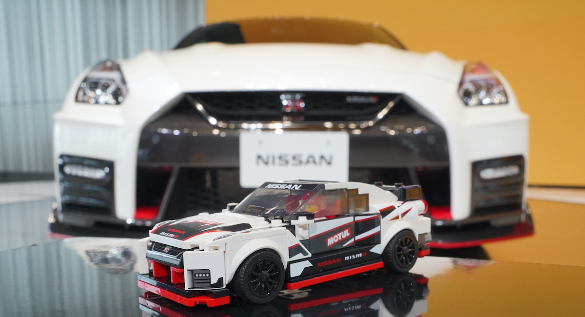 The LEGO Speed Champions Nissan GT-R Nismo in front of the real-life vehicle, the GT-R NISMO road car at the launch event of this set in Japan.