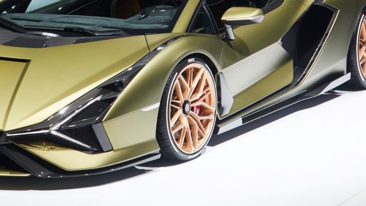 This is the detail of the Lamborghini Sian we're probably looking at in the teaser, the front wheel and the black styling element behind it.