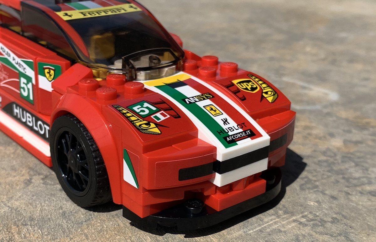 The front end of the 458 Italia GT2 with LEGO using both a black plate (centre) and two stickers adjoining either side of it to create a grille effect (although I wish I'd spaced these out better, as the real car has gaps). The use of stickers to create the look of the front is obvious from this angle, and those black rims only really pop in direct light like this.
