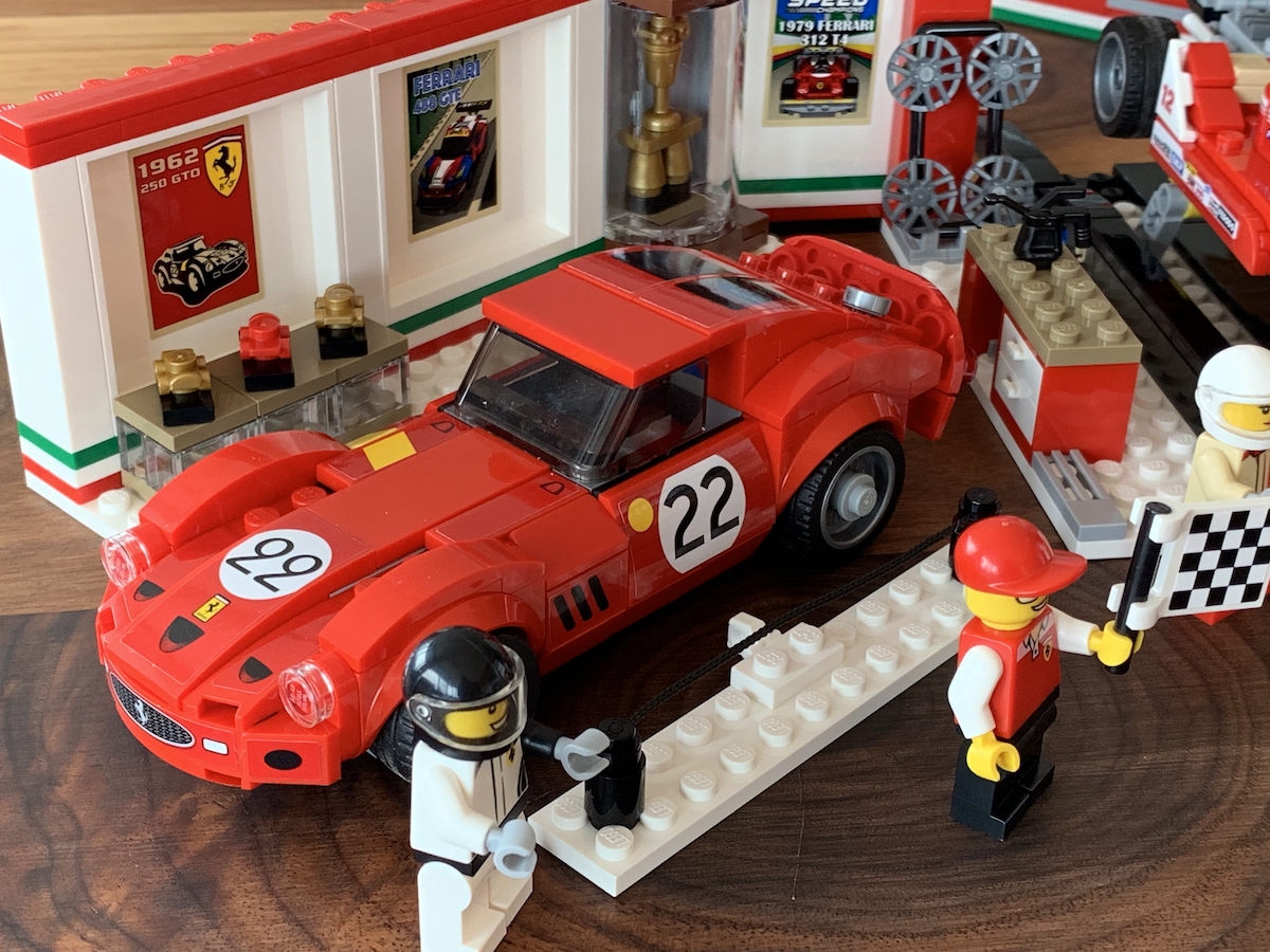 The 250 GTO numbered 22 with it's roped off fence in front of Ferrari's trophy cabinet. The poster stickers that go on the garage walls of this set are amazing by themselves.