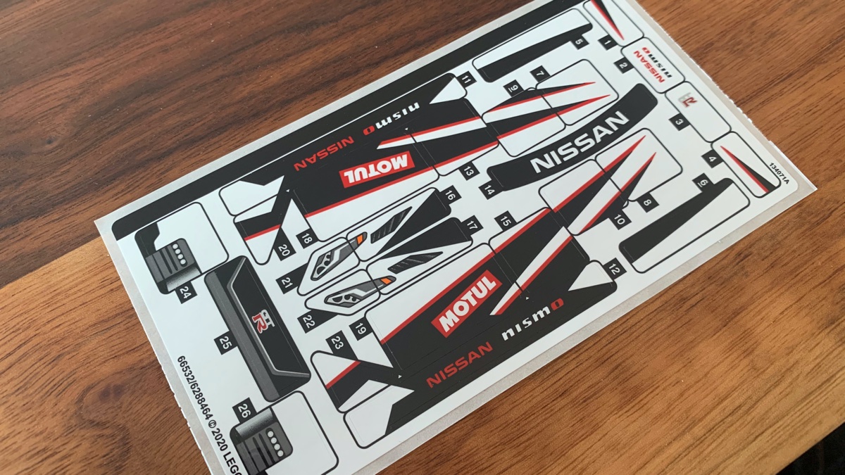 With 26 stickers on the sheet, this model will keep you busy applying them - as this replicates a drift/race car there are decals over nearly every surface on the model. Even the instruction booklet ends up getting one of the stickers wrong (upside down) on the side!